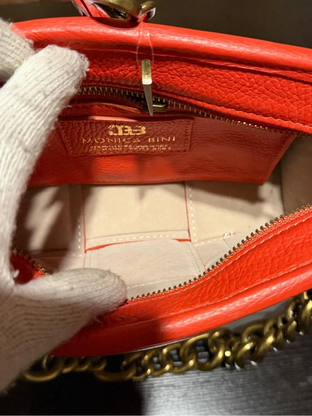 Monica Bini Orange pebbled small shoulder bag zip closure gold chain strap.
